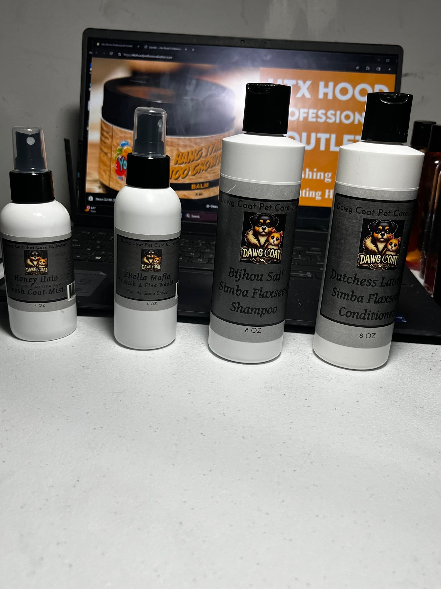 Set of hair care products on a white surface with a blurred background