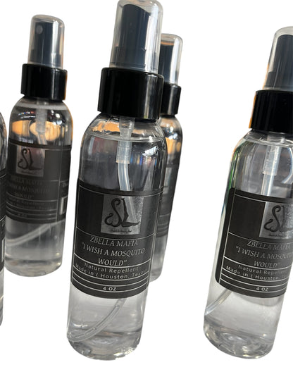 Clear spray bottles with black labels on a white background