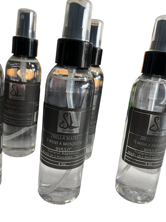 Clear spray bottles with black labels on a white background